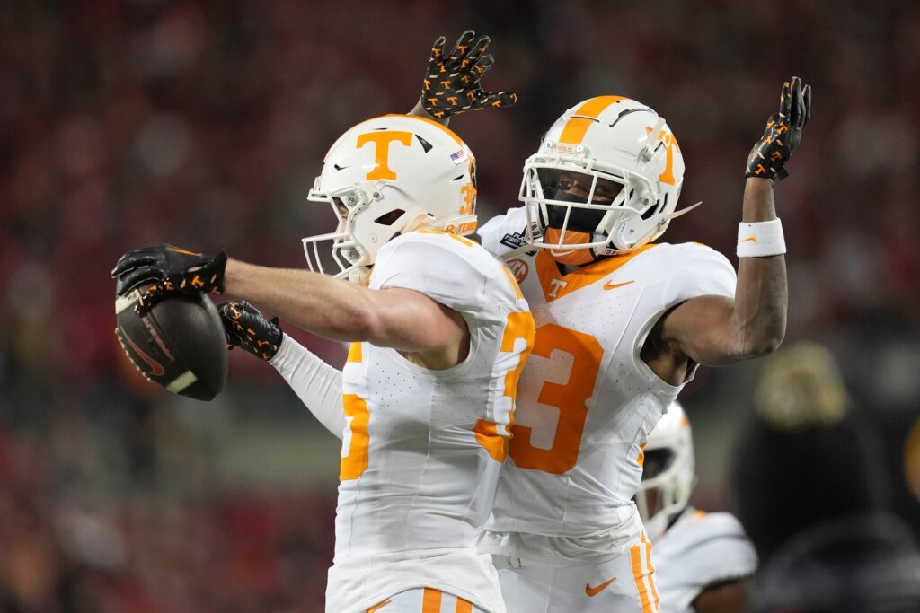 Tennessee defensive backs Will Brooks (35) and Boo Carter (23) celebrate after Brooks made an interception during the NCAA college football playoff game against Ohio State on Saturday, Dec. 21, 2024, in Columbus, Ohio.