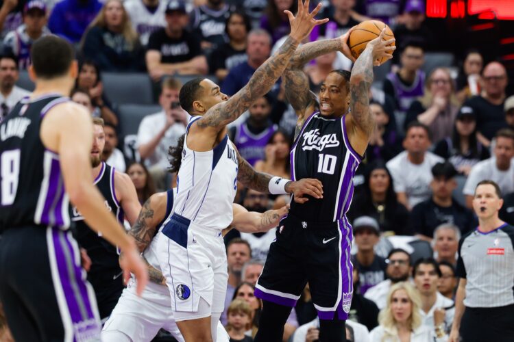 Apr 16, 2025; Sacramento, California, USA; Sacramento Kings forward DeMar DeRozan (10) is defended by Dallas Mavericks forward P.J. Washington (25) during the first quarter at Golden 1 Center. Mandatory Credit: Sergio Estrada-Imagn Images