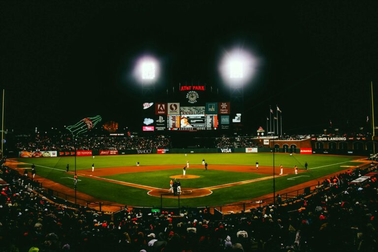 A baseball stadium lit up at night.