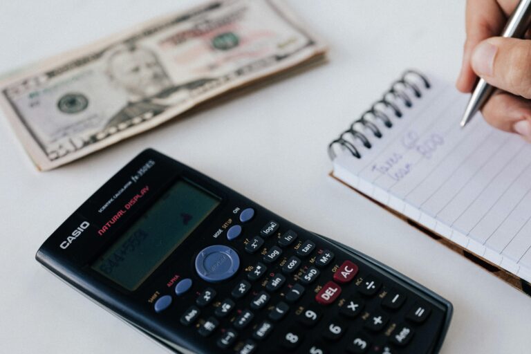 A Calculator, a notepad, a pen, and some money.